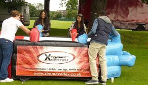People playing inflatable air football