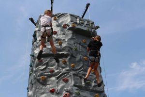 2 Players climbing up the Rock Climbing Tower