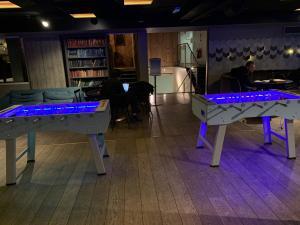 A pair of foosball tables