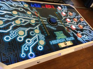 Close up of the table surface and buttons on the Neuron Race reaction game.