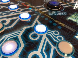 Close up of the illuminated buttons on the Neruon Race Reaction game.