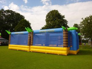 Inflatable sports arena set up on a field at a family fun day.