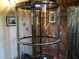 Close up of a cash cylinder game set up for an evening event.