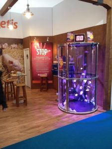 A grab a grand machine set up on a trade stand at an exhibition event.