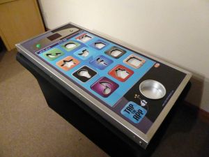 A giant mobile phone shaped steady hand game set up in an office for an event.