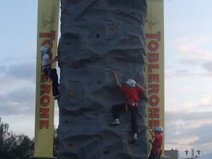 Thumbnail of a mobile climbing wall with Toblerone branded banners