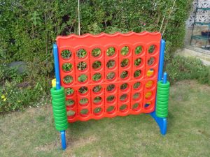 Giant Connect 4 garden game set up for an event.