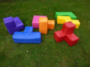 Giant Soma Cube Puzzle with seven brightly coloured pieces.