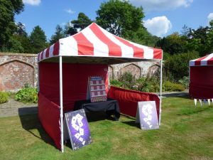 Gazebo with giant Higher or Lower traditional side stall game.