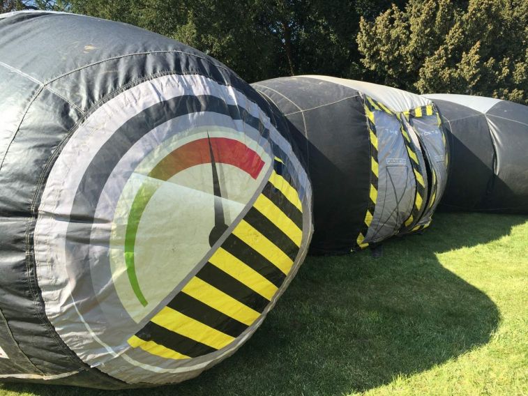 Inflatable Laser Tag arena which is a dome shaped game where players enter a central door into a darkened arena.