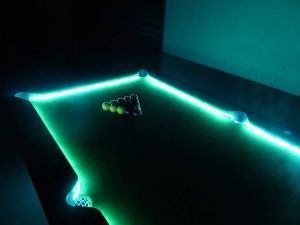 Pool table complete with colour changing LED lights at an evening event.
