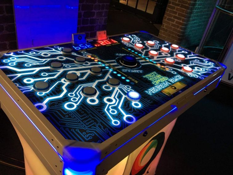 Neuron Race reaction game complete with LED lighting and table with Xtreme Vortex branded table skirt.