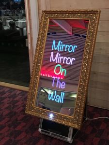 Image of a Magic Selfie Mirror photo booth set up and ready for hire at an event.