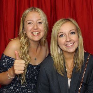 2 Ladies Smiling in the photo booth