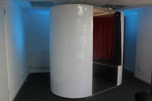 White coloured photo booth set up and ready for hire at an event