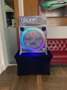 The Vault reaction game with a plain black table skirt