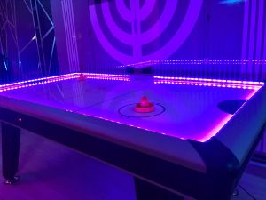 LED Air Hockey with purple lights