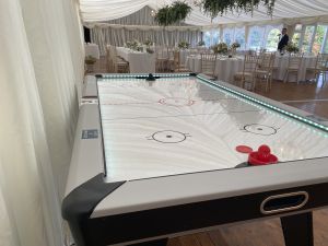 Air hockey at the wedding venue