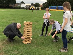 A Group Playing Giant Jenga