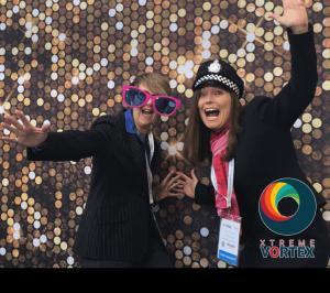 Ladies with props posing at the GIF Array Booth