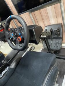 Close Up of a Simulator wheel and foot pedals