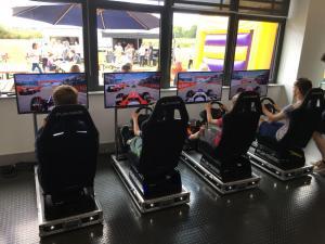 Players racing against each other on the Car Racing Simulators