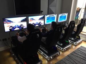 2 Players racing each other on the LED race simulators