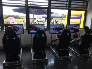 Back view of the 4 LED Race Simulators at an event.