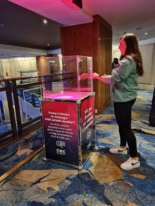 Person using the Safe Cracker with Branding 4 panels