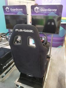 Racing Simulators with Branded Headers on Monitor