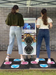 2 friends on the dance machine