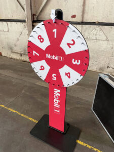 Prize Wheel red and white branding on the wheel section and on the stand
